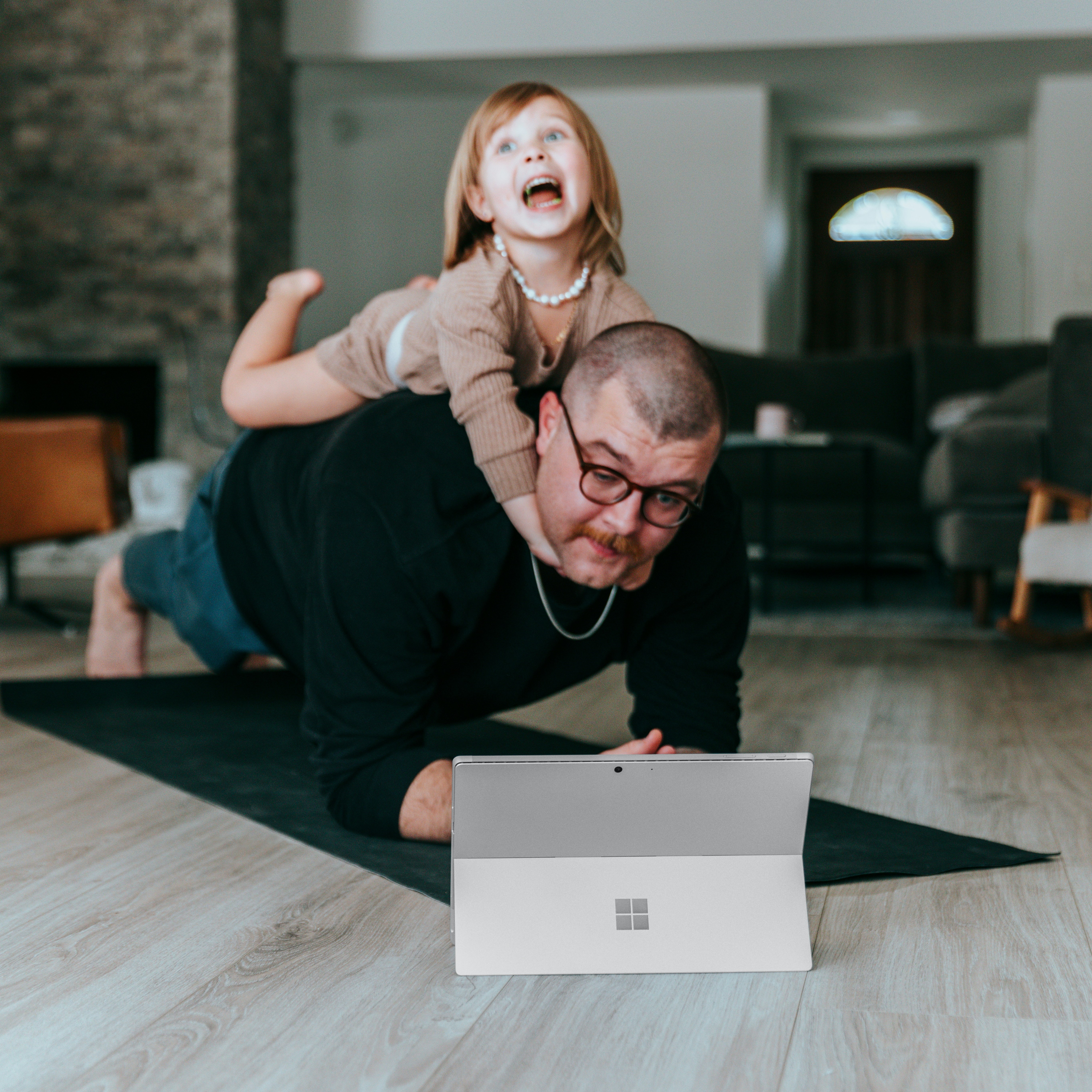 Father and Daughter playing on a computer